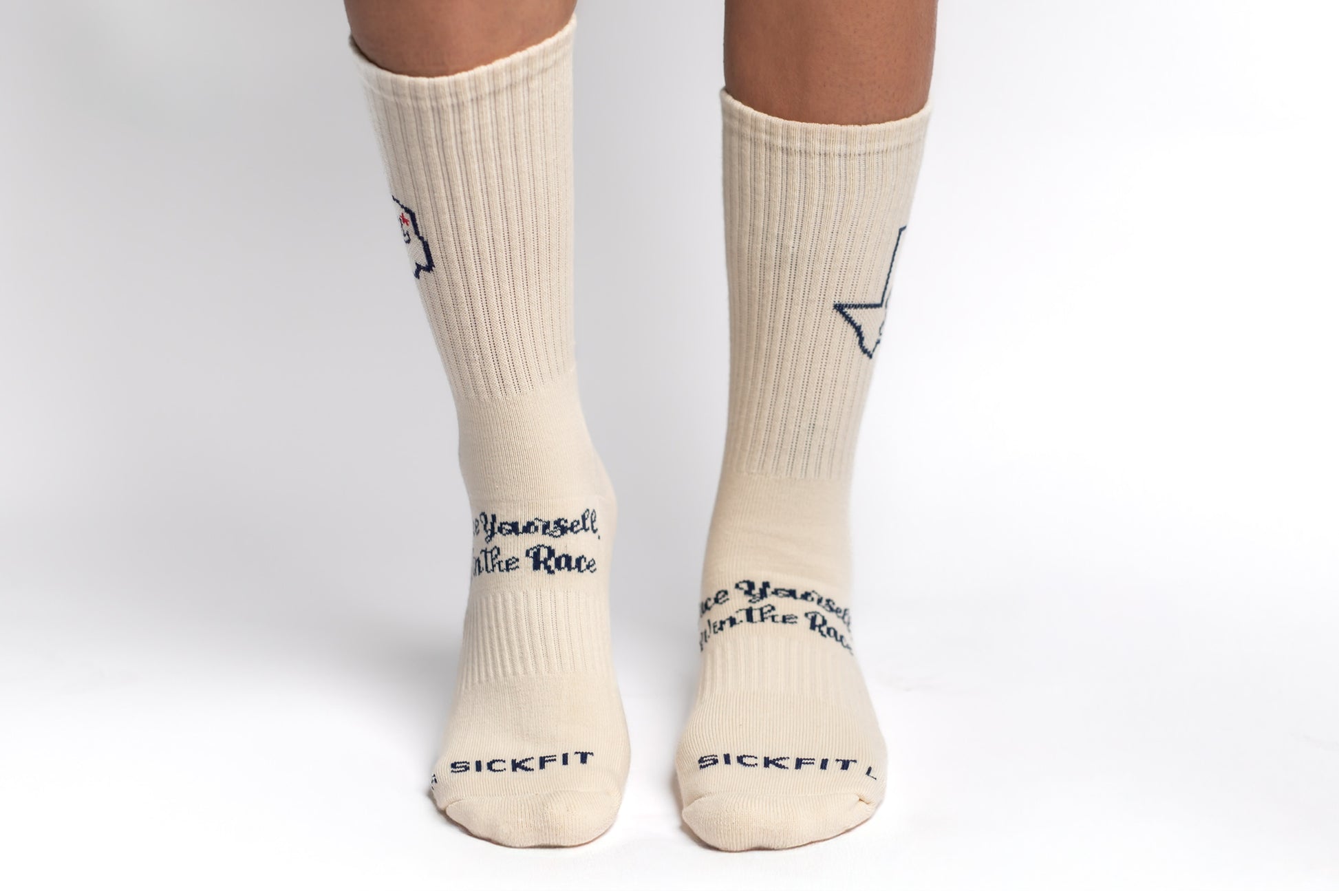 A pair of creme SickFit crew compression socks with state of Texas design and text.