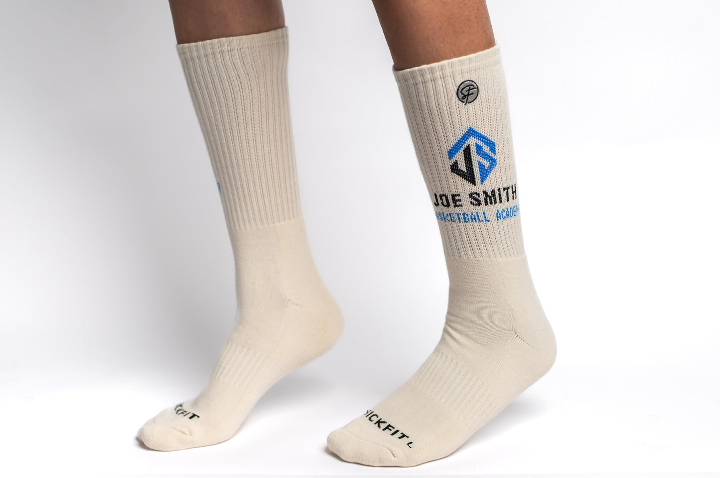 Beige crew compression socks with a logo and text on a white background