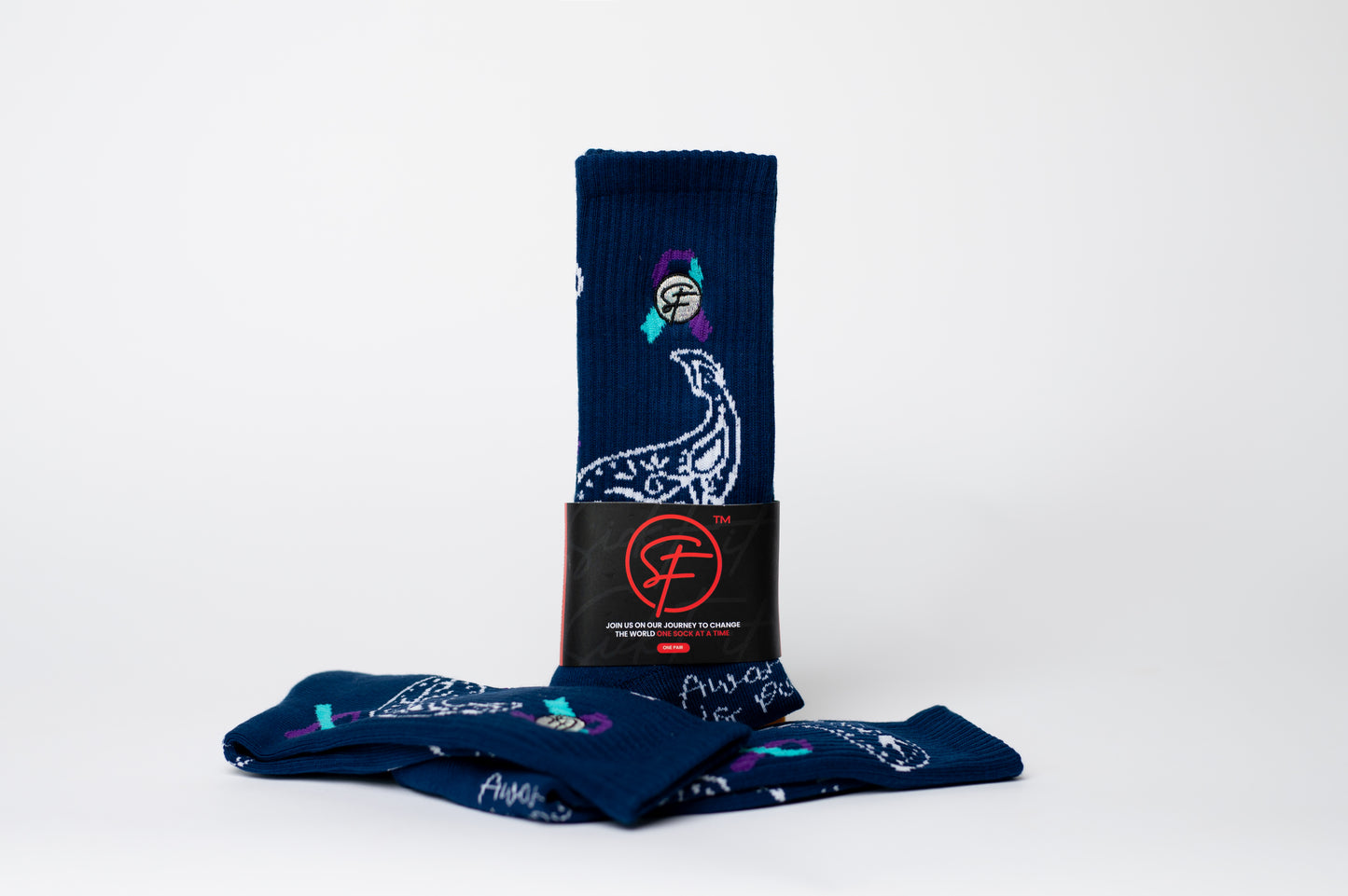 Set of navy blue crew compression socks with graphic designs on a white background