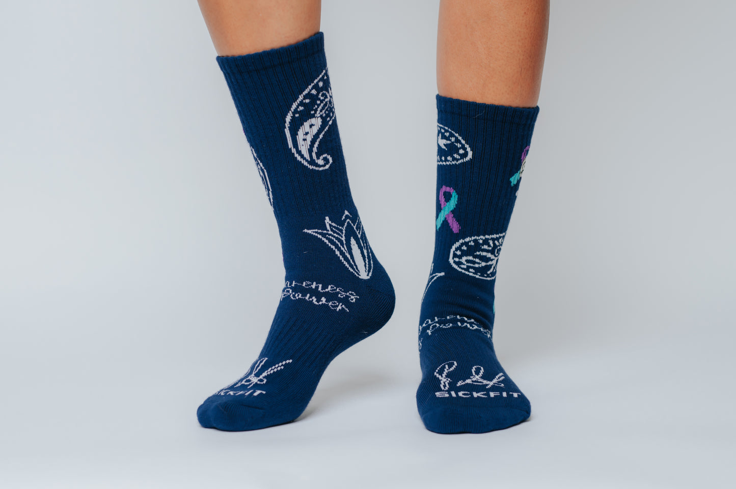 Navy blue crew compression socks with white designs and text on a light gray background