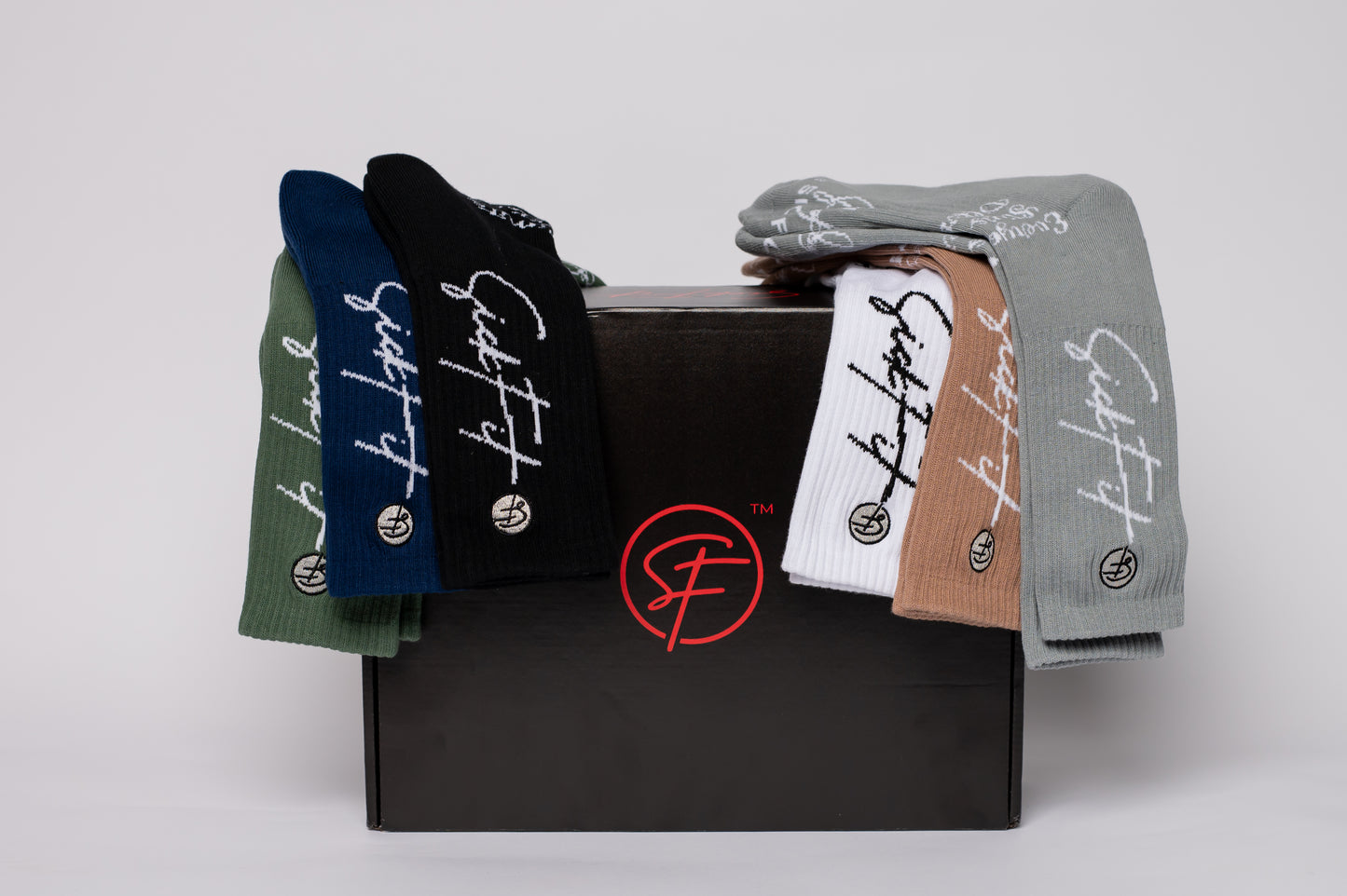 Box of crew compression socks with a brand logo on a white background