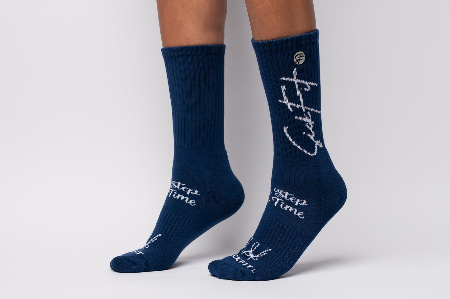 Navy blue crew compression socks with white text on a white background