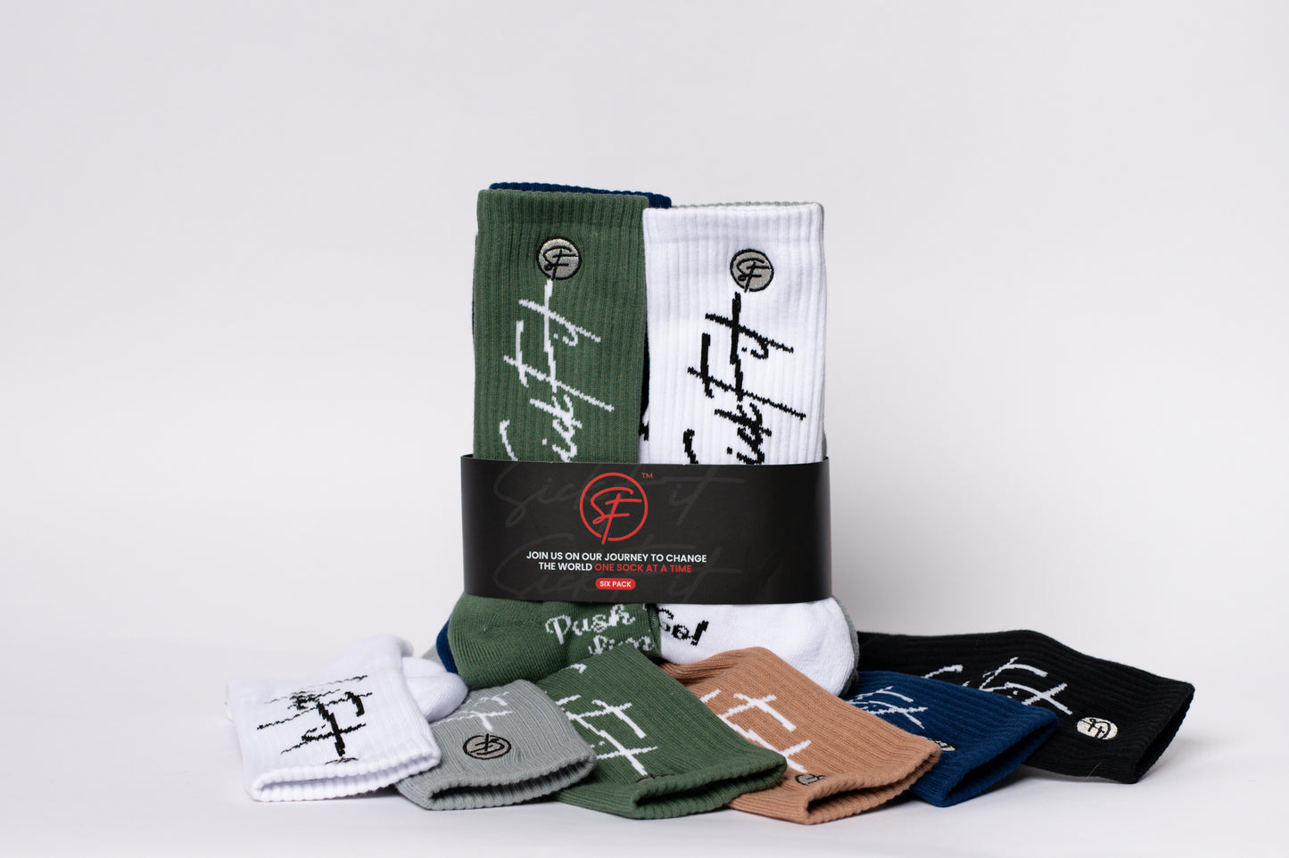 Collection of crew compression socks with branding on a light gray background