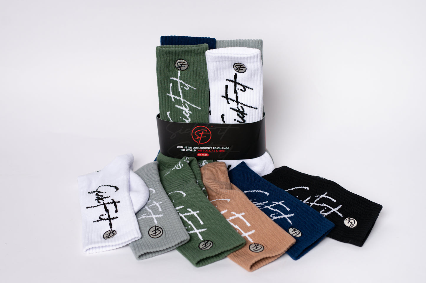 Set of colorful crew compression socks with branding on a white background