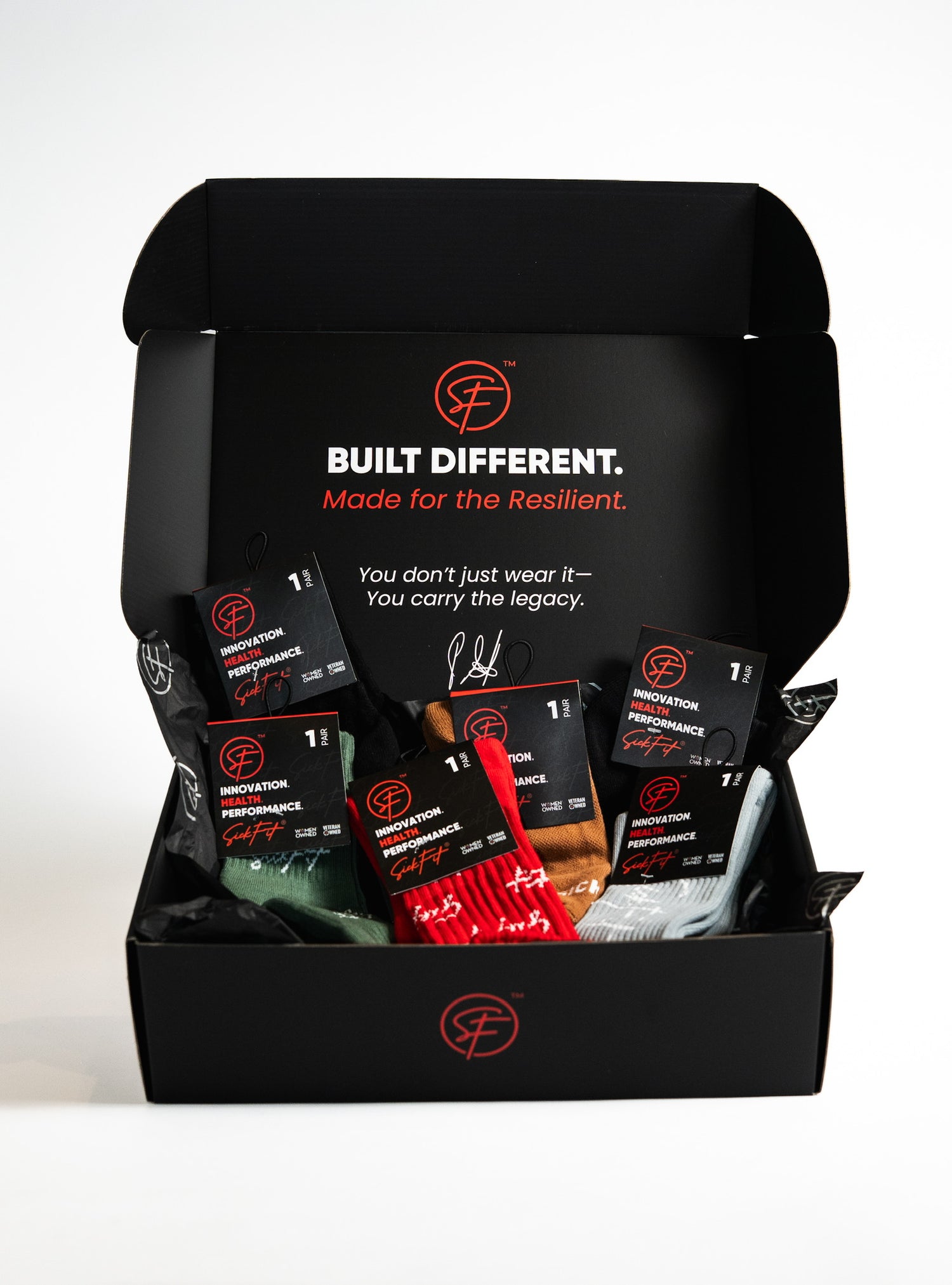 Black gift box with SicFit branded different color socks(Black, brown, green, grey) on a white background