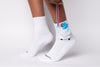 White sensory healthcare kids socks with cartoon character design on a white background