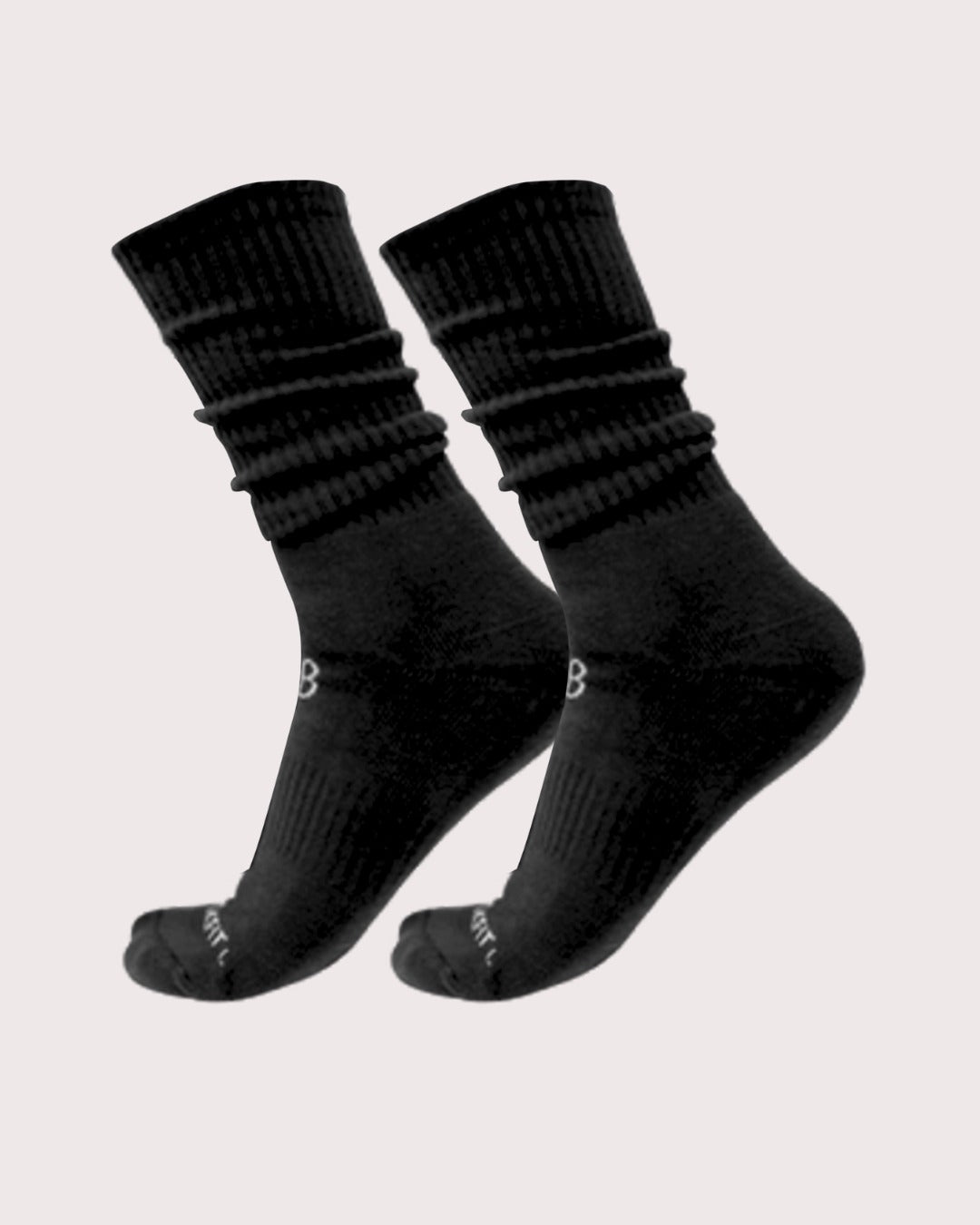 Pair of black socks on a light gray background