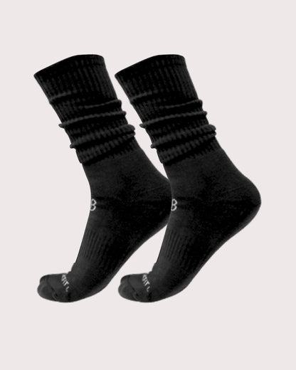 Pair of black socks on a light gray background