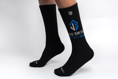 Black crew compression socks with a logo and text "Joe Smith" on a white background