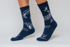 Navy blue crew compression socks with white designs for Bella's Story and text on a plain background
