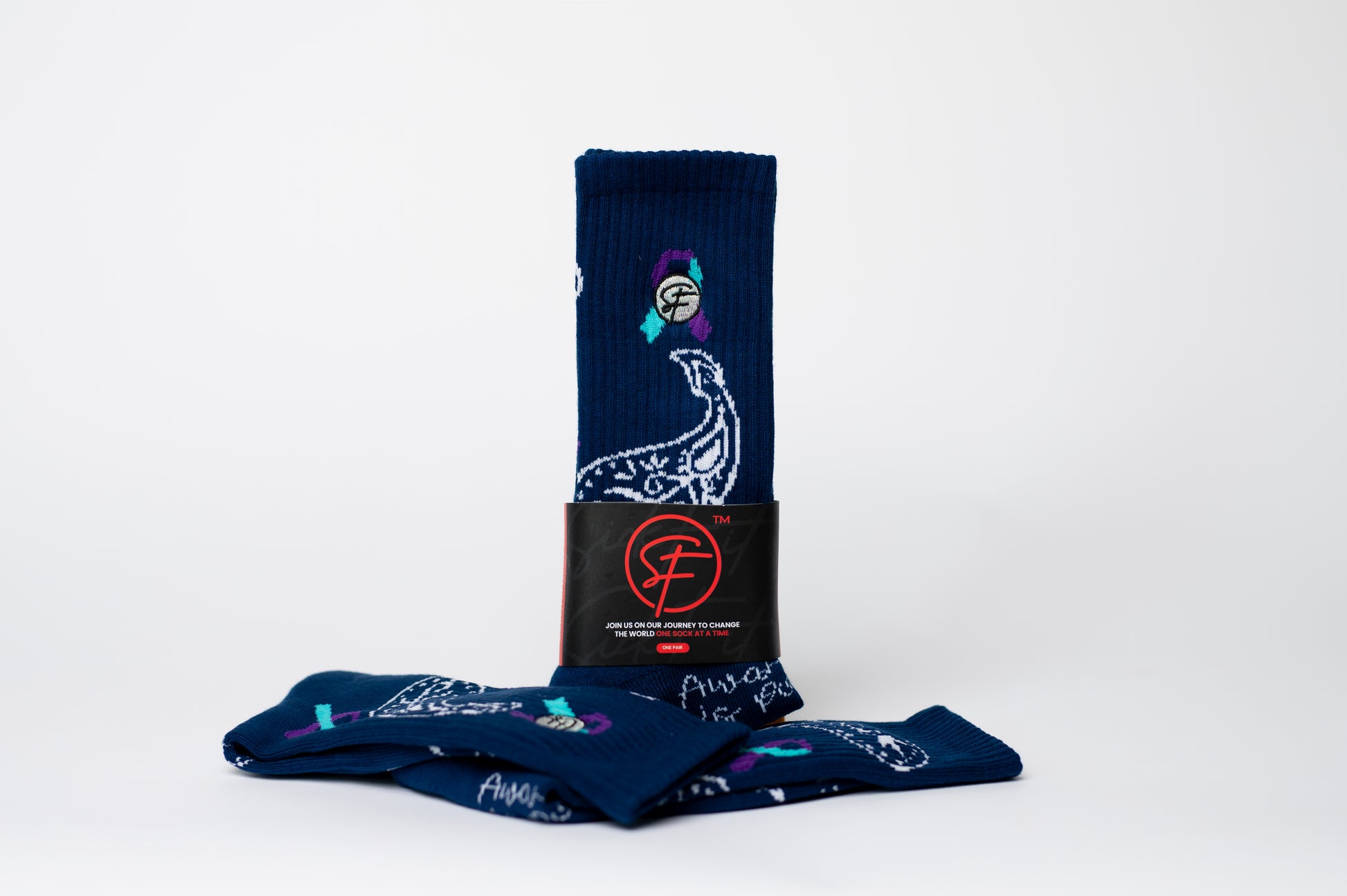 Set of navy blue crew compression socks with graphic designs on a white background