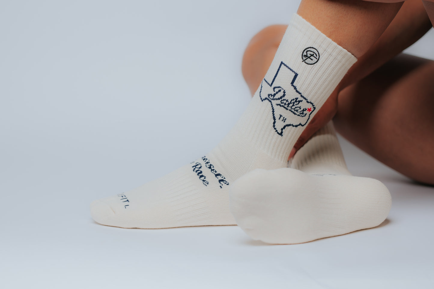 White crew compression socks with the state of Texas and text