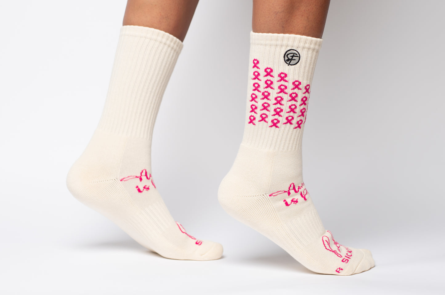 White Crew Compression socks with pink ribbons for and text on a white background