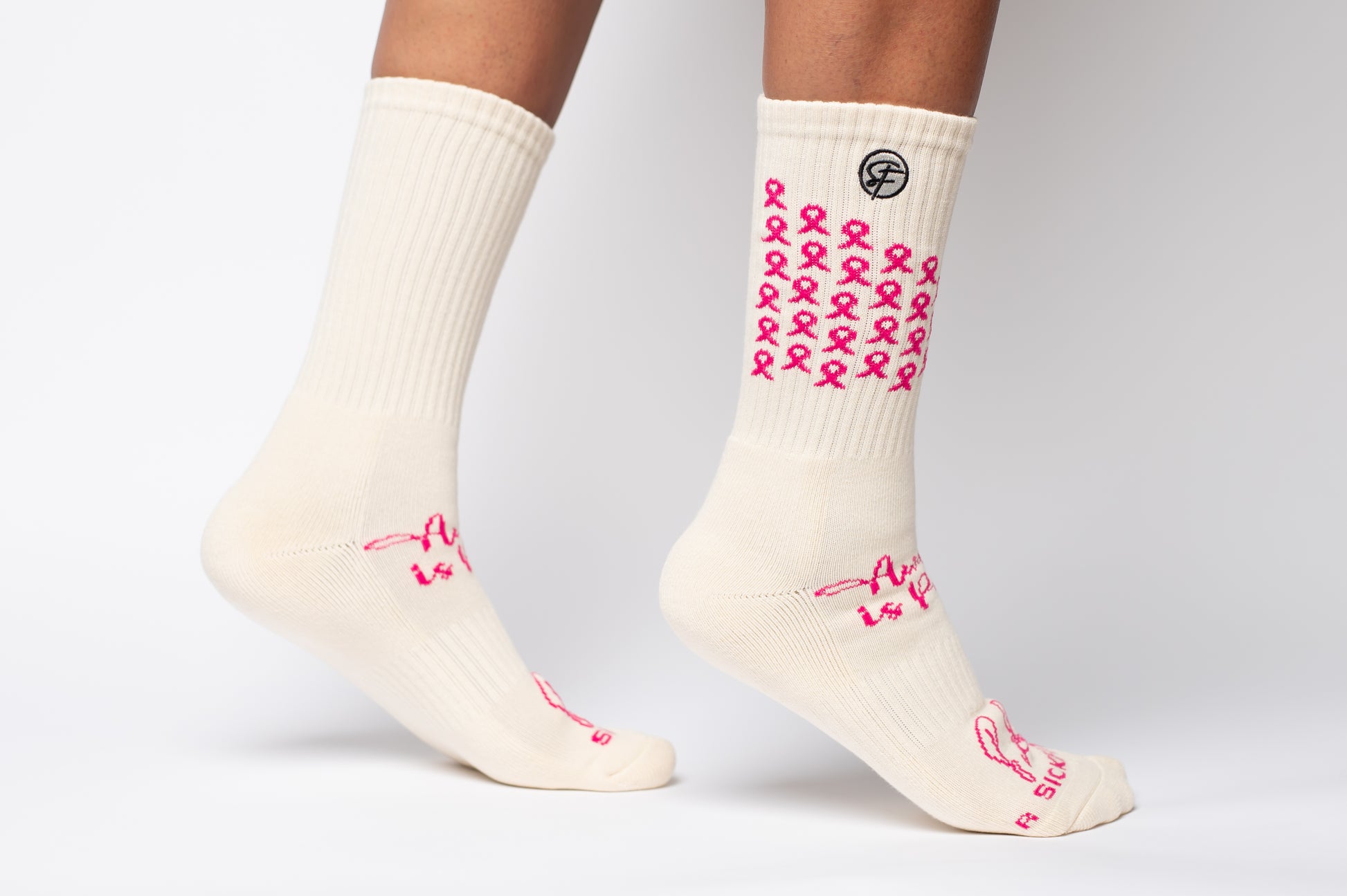 White Crew Compression socks with pink ribbons for and text on a white background