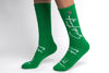 A pair of Green Sickfit crew compression socks with white text