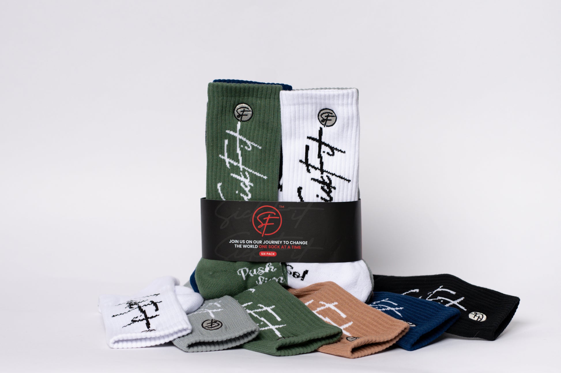 Collection of crew compression socks with branding on a light gray background
